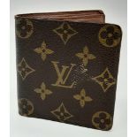 A Louis Vuitton Wallet. Monogram canvas with brown leather pocket interior. 10 x 10cm. Some scuff