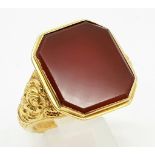 An 18K Yellow Gold Victorian Carnelian Signet Gents Ring. Large hexagonal carnelian with rich scroll