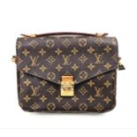 A Louis Vuitton Pochette Metis Bag. Monogram canvas. Gilded hardware. Outer zipped compartment.