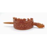 A very collectable, archaic, Chinese, orange-brown jade hairpin crown, with hand carved dragons.