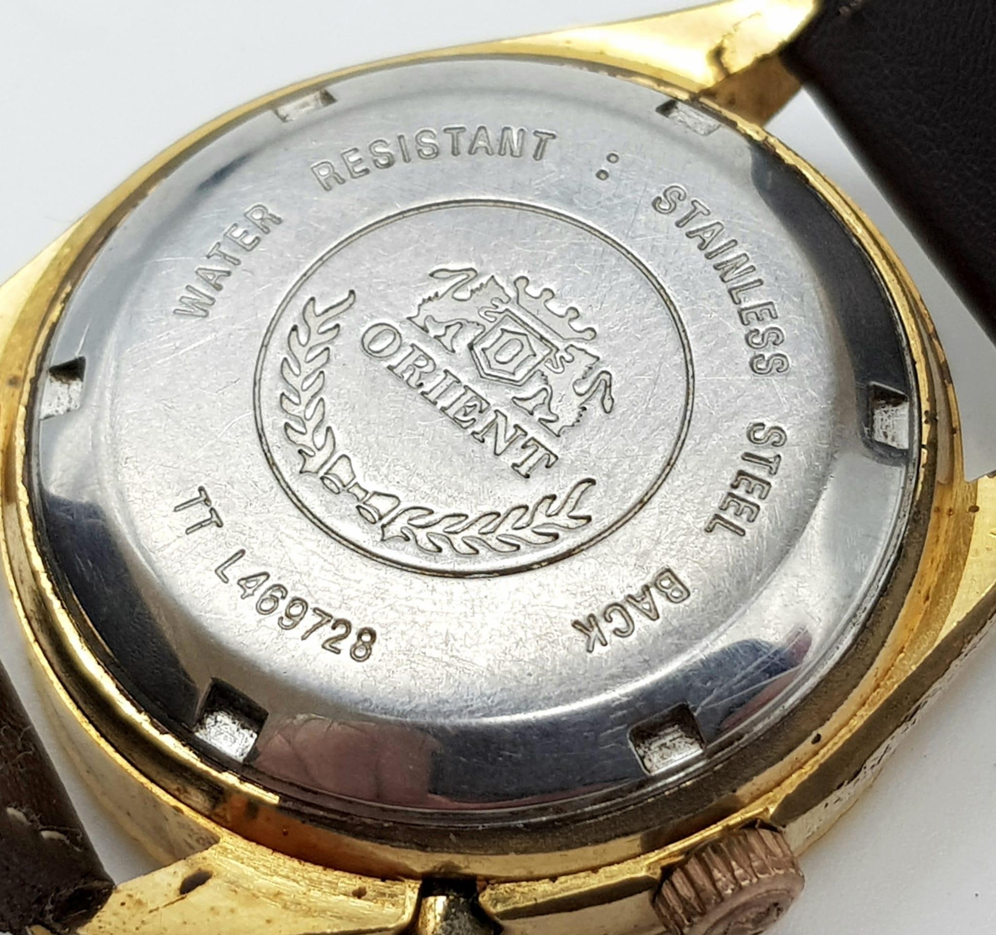 A Vintage Orient 21 Jewel Crystal Gents Watch. Brown leather strap. Two tone case - 36mm. Gold - Image 4 of 5