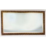 A Ornately Framed Mirror. 100cm x 54cm. a/f, please see photos for condition. Collection from