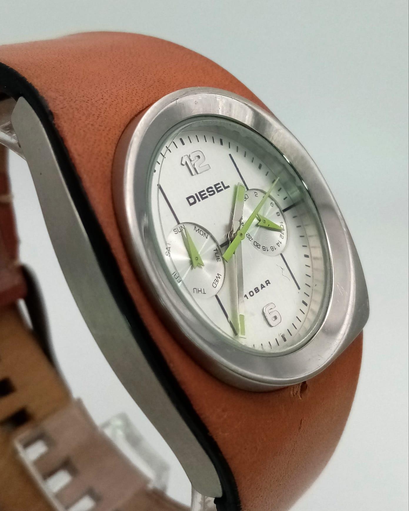 A DIESEL stainless steel watch with its original leather strap. 34 mm case, multi-dial face, water - Image 2 of 5