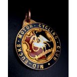 A 9K Yellow Gold and Enamel Motor Cycling Medal/Pendant. 8.7g total weight.