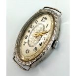 A vintage, 14K white gold ladies watch. Oval case 27 x 16 mm, with gold tone hands.