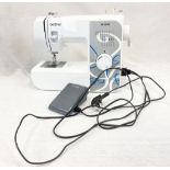 A Brother AE 1700 Sewing Machine with Footpad. In good condition - In working order.