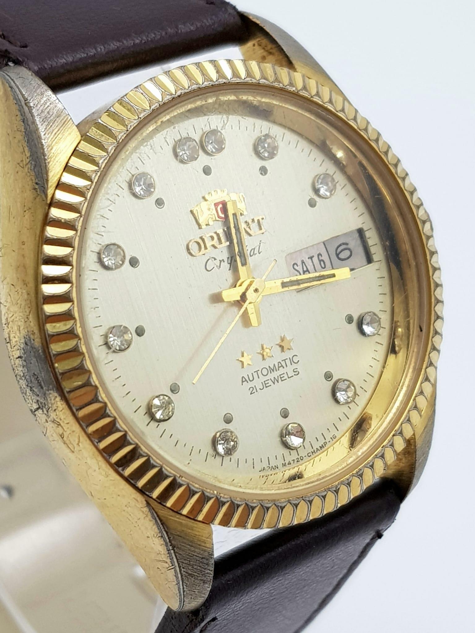 A Vintage Orient 21 Jewel Crystal Gents Watch. Brown leather strap. Two tone case - 36mm. Gold - Image 3 of 5