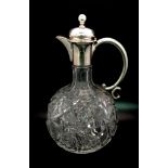 An Antique Cut-Glass and White Metal Claret Jug. 20cm tall. Possibly interesting makers mark.