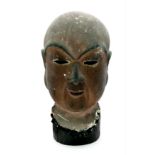 A A SMALL TERRACOTTA BUDDHIST HEAD , SMOKE COVERED TEMPLE FIND. 15 X 10cms