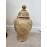 A Large Beige Polished Stone Urn with Bell-Shaped Lid. Slight chip to lid. 40 x 20 cms.