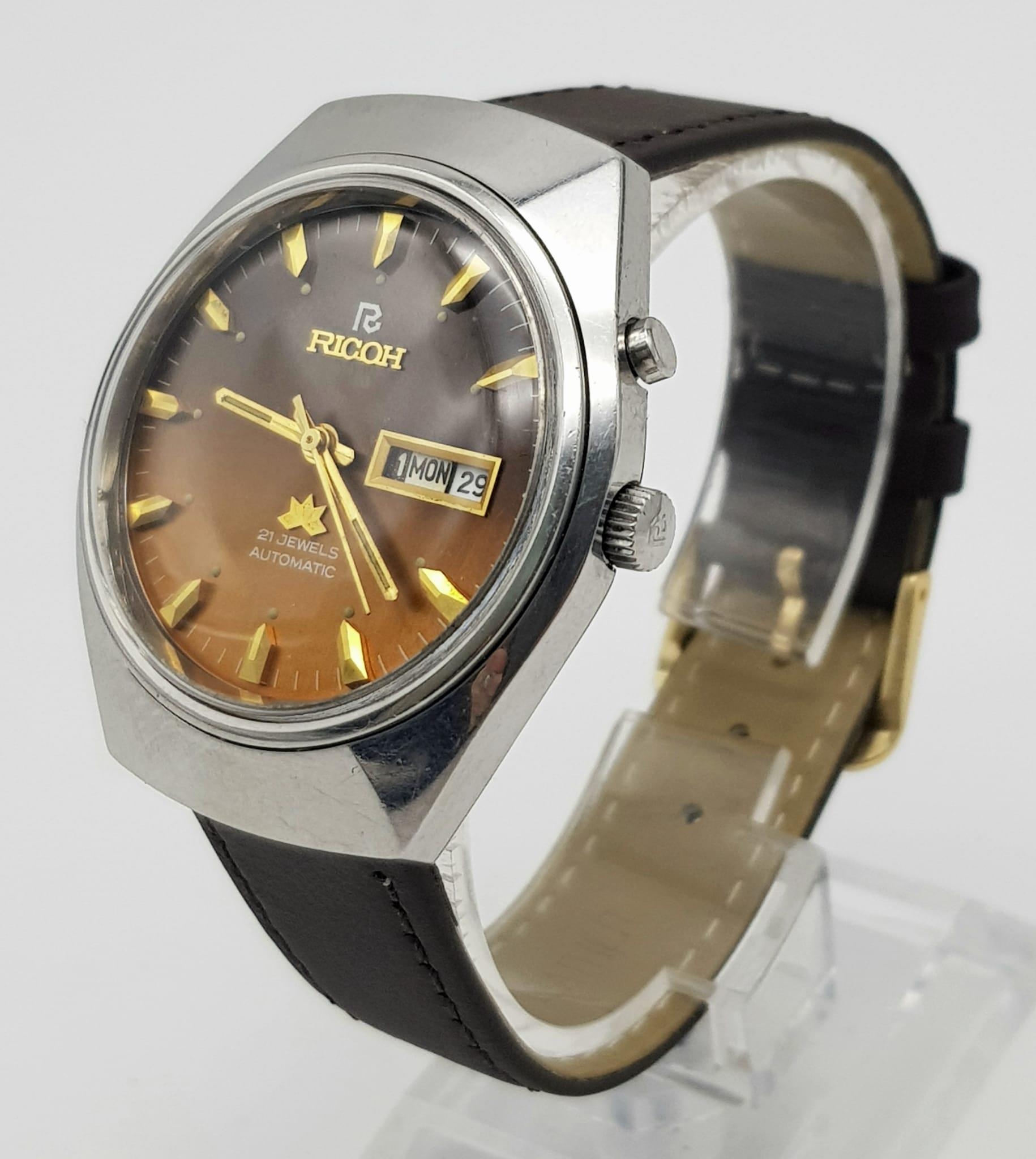 A Vintage Ricoh 21 Jewel Automatic Gents Watch. Brown leather strap with golden brown dial. - Image 2 of 5