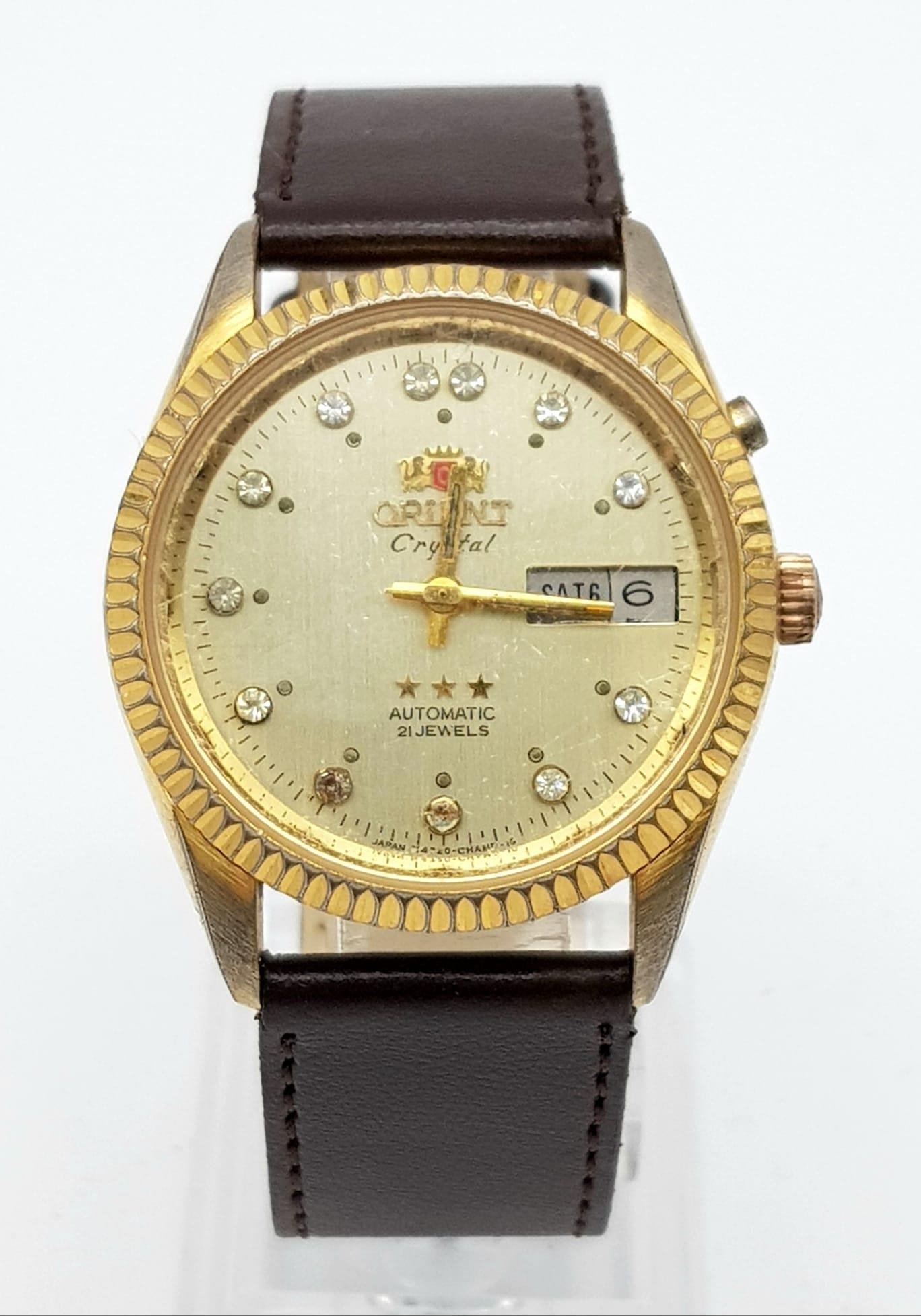 A Vintage Orient 21 Jewel Crystal Gents Watch. Brown leather strap. Two tone case - 36mm. Gold