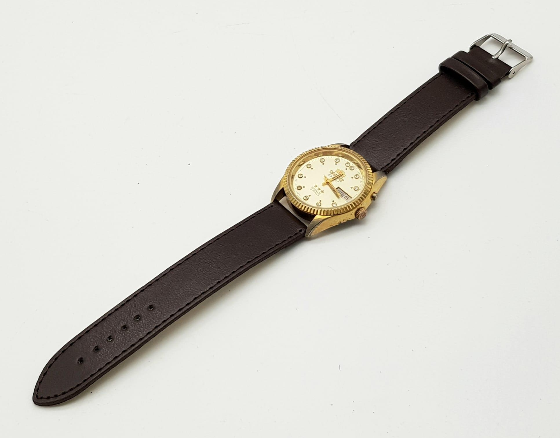 A Vintage Orient 21 Jewel Crystal Gents Watch. Brown leather strap. Two tone case - 36mm. Gold - Image 5 of 5