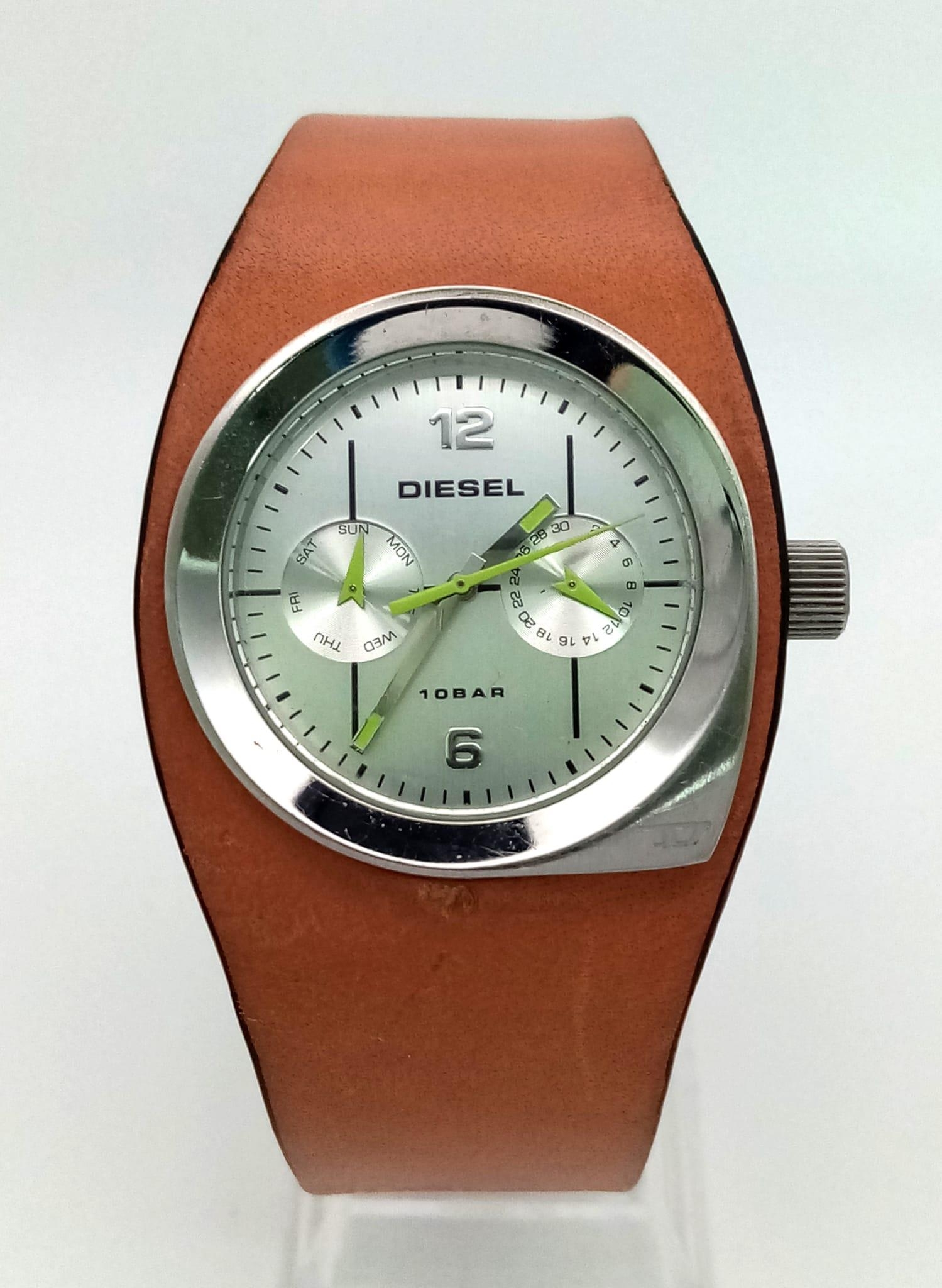 A DIESEL stainless steel watch with its original leather strap. 34 mm case, multi-dial face, water