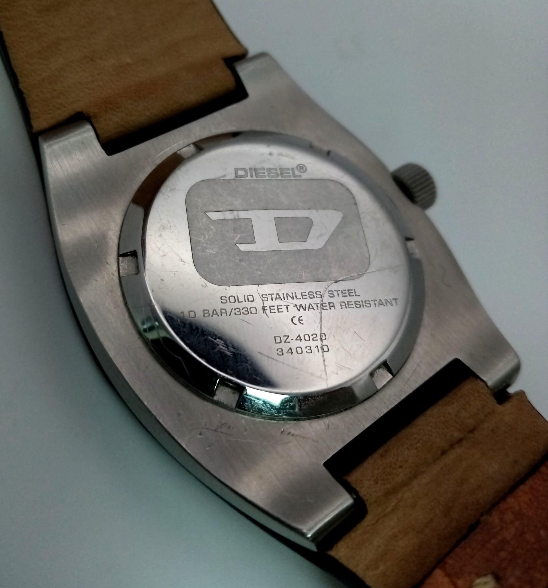 A DIESEL stainless steel watch with its original leather strap. 34 mm case, multi-dial face, water - Image 5 of 5