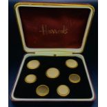 A Vintage Box of Seven Two-Tone Buttons from Harrods. In a Harrods presentation box.