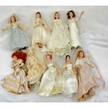 A Collection Of 9 Dolls in wedding Dresses, all 19cm including the tiara and stand.