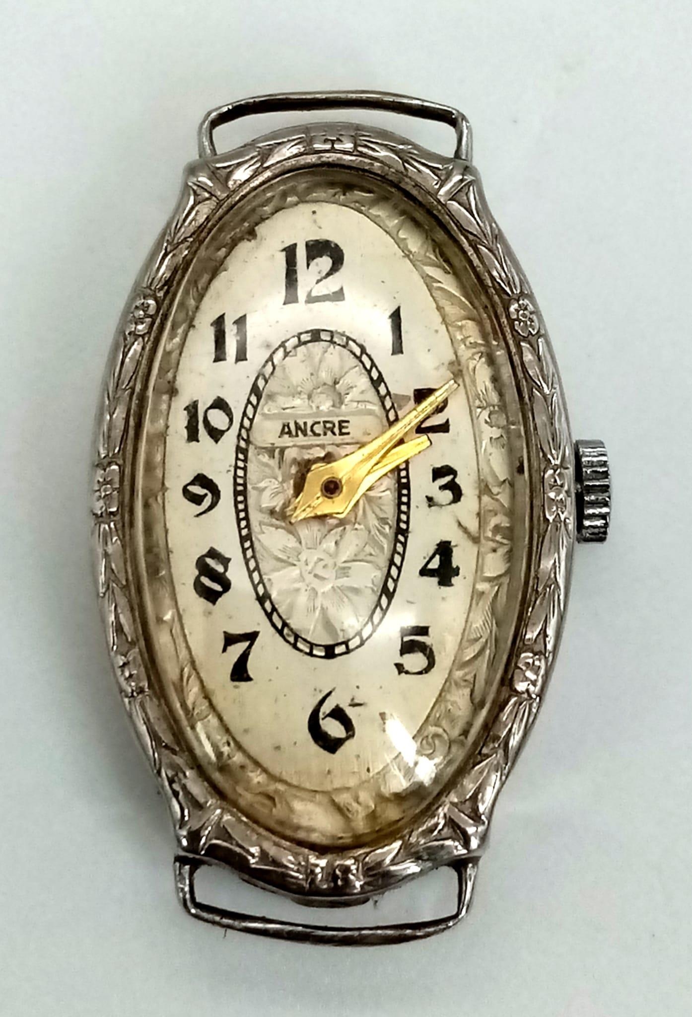 A vintage, 14K white gold ladies watch. Oval case 27 x 16 mm, with gold tone hands. - Image 2 of 3