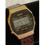 Vintage 1970s SEKONDA digital wristwatch finished in black and gold tone. Complete with genuine