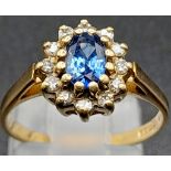 A Vintage 9K Yellow Gold Ceylon Sapphire and Diamond Ring. The oval Ceylon sapphire punches well