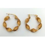 9k yellow gold twist creole hoop earrings. Weighs1.8g. 2.2cm diameter