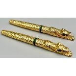 A designer style, heavy, panther shaped, pair of gold filled pens in presentation boxes. One is a