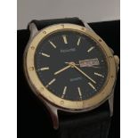 Gentlemans ACCURIST 135000 Quartz Wristwatch, Black face, Day/Date model. Having golden digits and