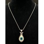 Solid silver and enamel eye pendant on 16" silver chain. Pendant 2.8cm length, total weight 10.3