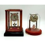Two Wonderful Vintage possibly Antique Girl on Swing Glass- Cased mantle Clocks. Both are in working