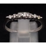 18K WHITE GOLD DIAMOND BAND RING. 0.20CT DIAMOND. TOTAL WEIGHT 2.3G. SIZE R/S