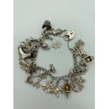 Vintage SILVER CHARM BRACELET Complete with 22 silver charms to include Horse, lamp, gondola, Ice