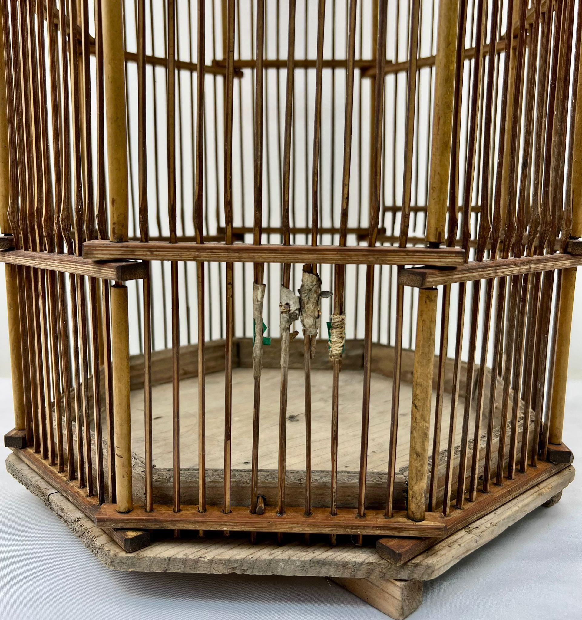 A VERY RARE ANTIQUE CHINESE BAMBOO BIRD CAGE FROM THE LATE 1800'S . HIGH HEXAGONAL DESIGN AND IN - Image 3 of 3