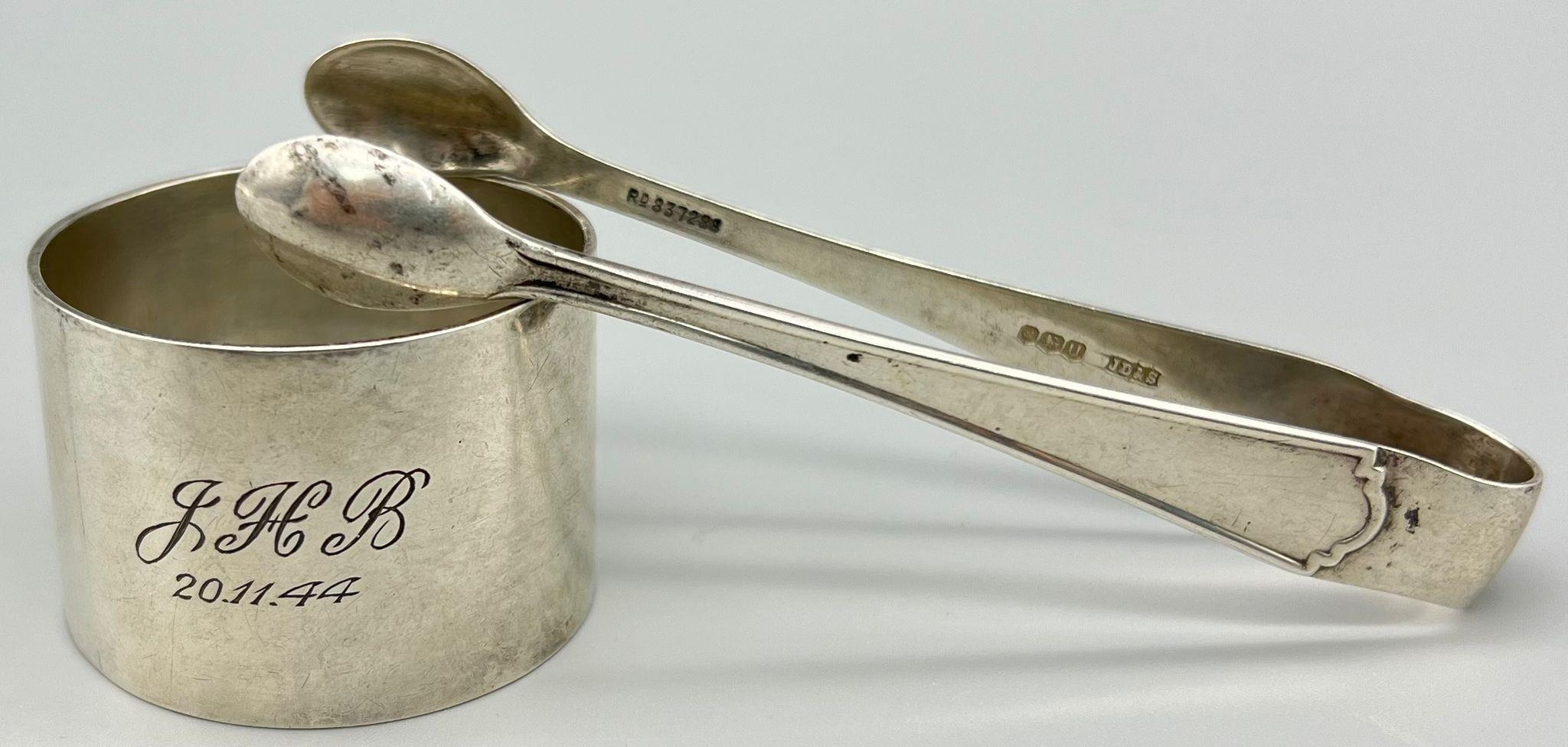A Quirky 925 Silver mix lot of Napkin Ring and tongs. Tongs are Marked for James Deakin &Sons
