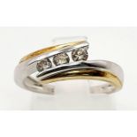 A 9K White and Yellow Gold Crossover Ring with 3 Separated diamonds. Size L/M. Total weight: 2.57g
