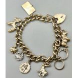 A Vintage 925 Silver Charm Bracelet with a Heart Clasp. 18cm. Total weight - 60g