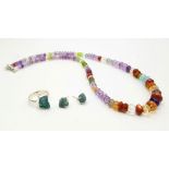 A multi-gemstone necklace with Citrine, amethyst, peridot, carnelian and garnet beads, with a 925