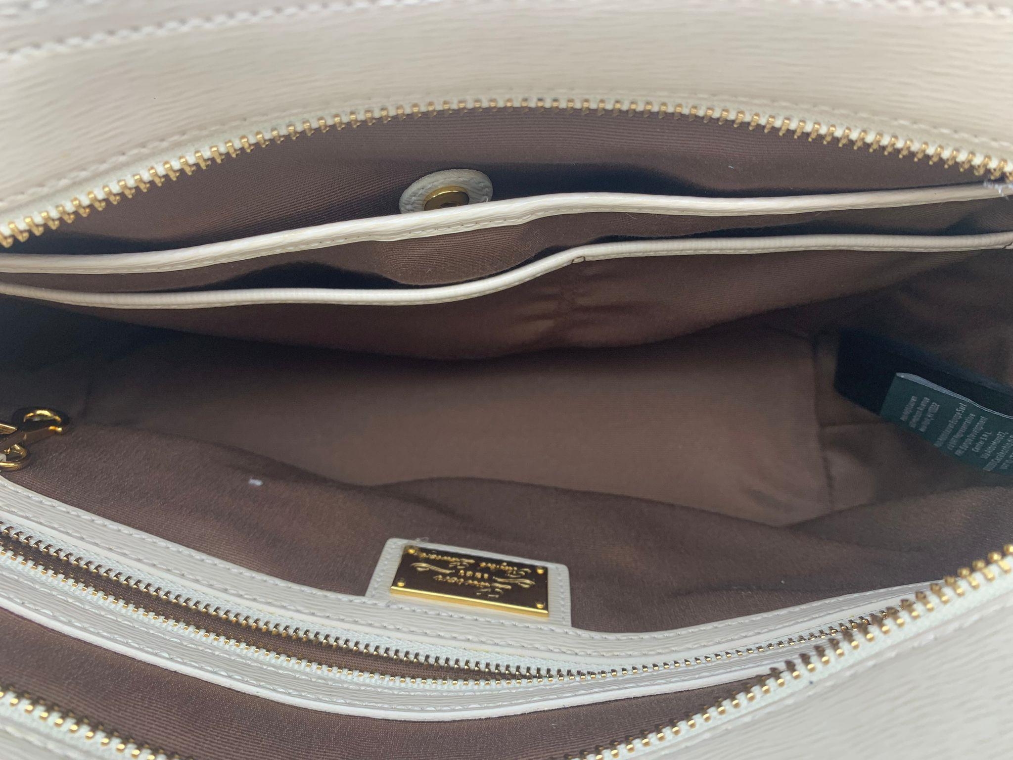 A Ralph Lauren Cream Leather Handbag. Two exterior flaps. Zipped inner compartment. 36cm width. 26cm - Image 6 of 12