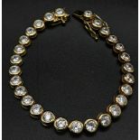 A gilded 925 hallmarked silver, CZ, articulated tennis bracelet. Ref: 20