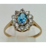 A Blue topaz and white stone 9K gold cluster ring. Size O. 1.65g total weight. Ref: 7