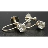 A Pair of 18K Gold and Diamond Earrings. Bright white round cut diamonds - 0.50ct total. Screw-fit