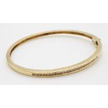 9K YELLOW GOLD DIAMOND SET BANGLE WITH SAFETY CATCH 0.40CT 9.9G