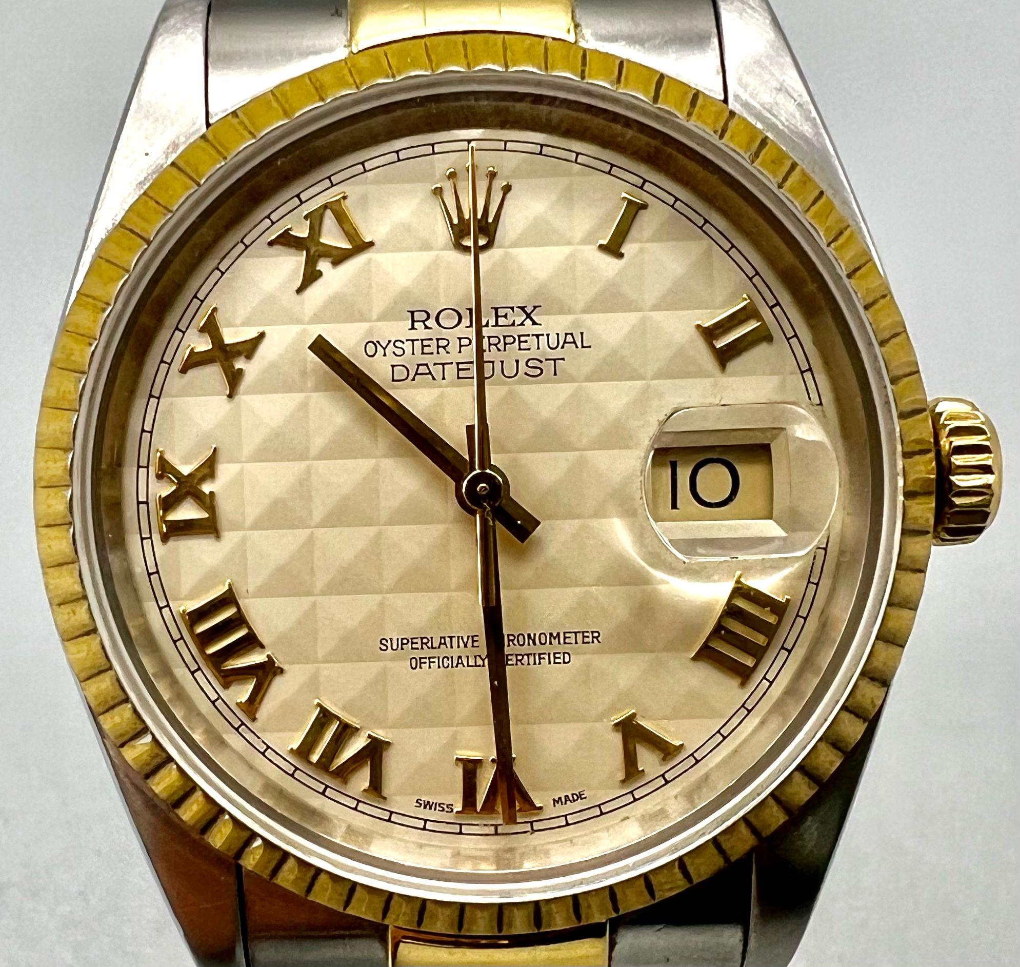 A Rolex Oyster Datejust Bi-Metal Gents Watch. Bi-metal strap and case - 36mm. Cream geometric