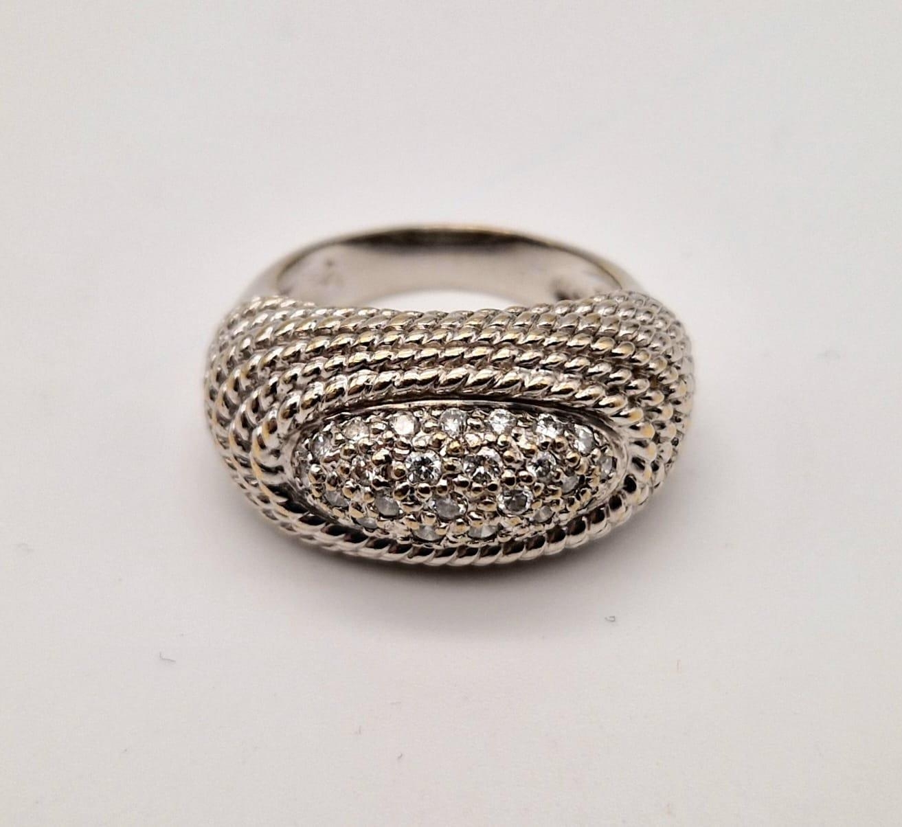 A fancy, 18 K yellow gold, pave diamond (0.25 carats) set ring. Size: I, weight: 9.1 g.