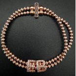 STERLIGN SILVER WITH ROSE GOLD VERMEIL STONE SET ELASTICATED BRACELET. WEIGHT 15.4G