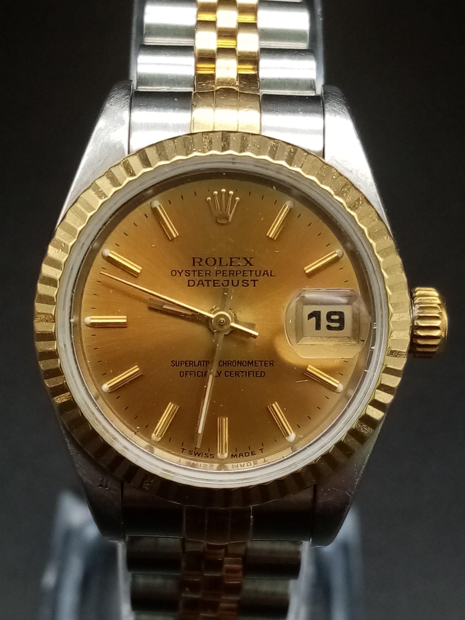 A Rolex Oyster Perpetual Datejust Ladies Watch. Bi-metal strap and case - 26mm. Gold tone dial
