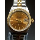 A Rolex Oyster Perpetual Datejust Ladies Watch. Bi-metal strap and case - 26mm. Gold tone dial