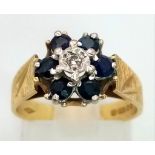 A Wonderful Vintage 18K Yellow Gold Sapphire and Diamond Floral Ring. Central diamond with six