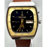 A Vintage Ricoh 21 Jewel Automatic Gents Watch. Brown leather strap. Stainless steel case - 35mm.