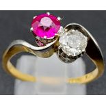 A Glorious 18K Yellow Gold Ruby and Diamond Crossover Ring. A beautiful clean round cut (0.6ct each)