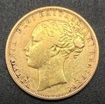 An 1871 Queen Victoria 22K Gold Full Sovereign.